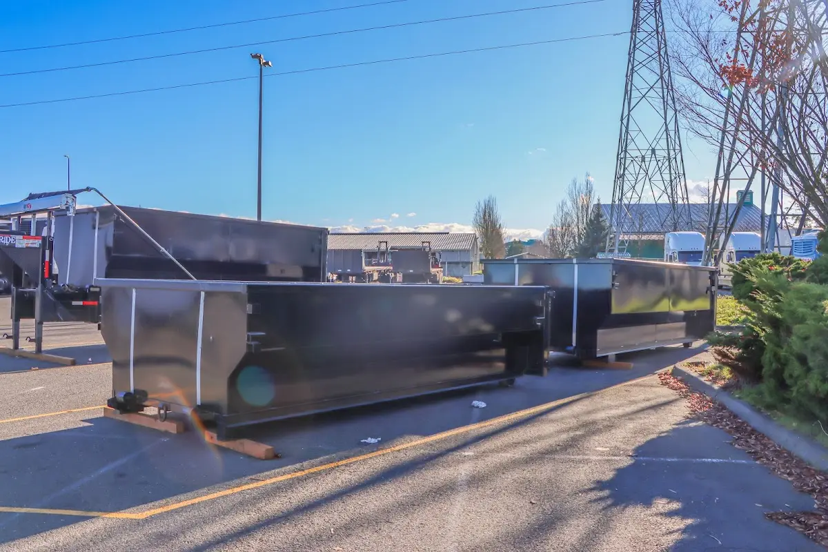 Roll-off dumpster ready for waste disposal at job site for Concrete Dumpster Rental in Lawrence